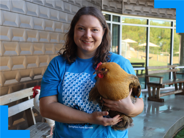  Teacher Amanda Trotter holding a chicken